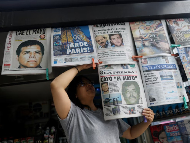 a newspaper seller arranges newspapers reporting the el paso texas u s arrest of mexican drug lord ismael el mayo zambada and joaquin guzman lopez el chapo guzman s son in mexico city mexico july 26 2024 photo reuters